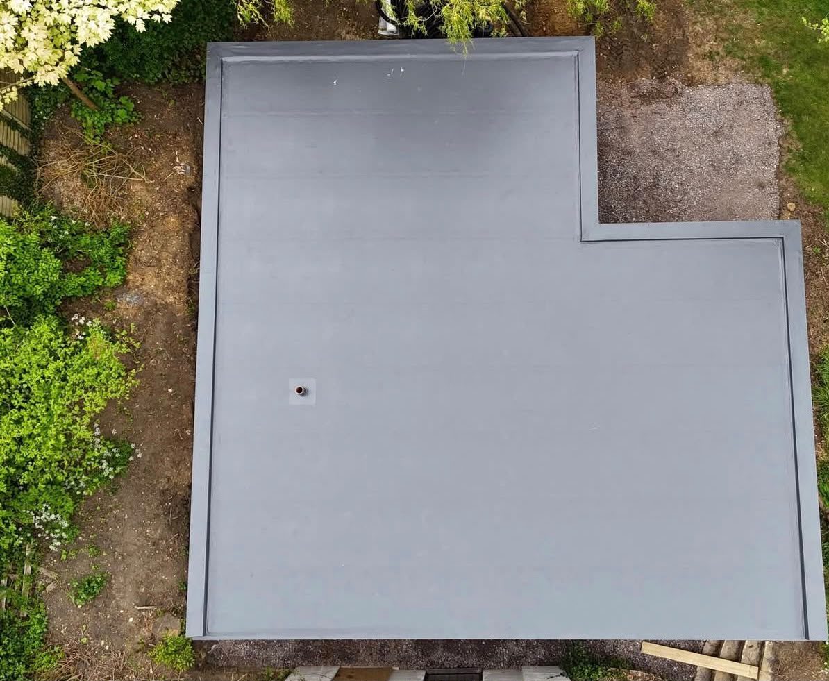 Completed grey single-ply membrane flat roof on a domestic property in Bromley