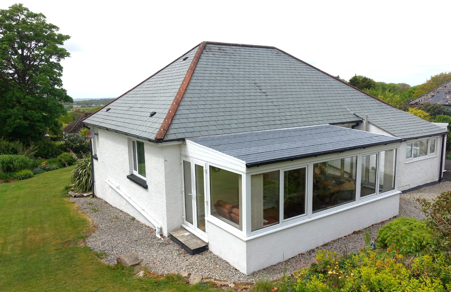 Refurbished flat roof on a bungalow extension with new waterproofing and trims