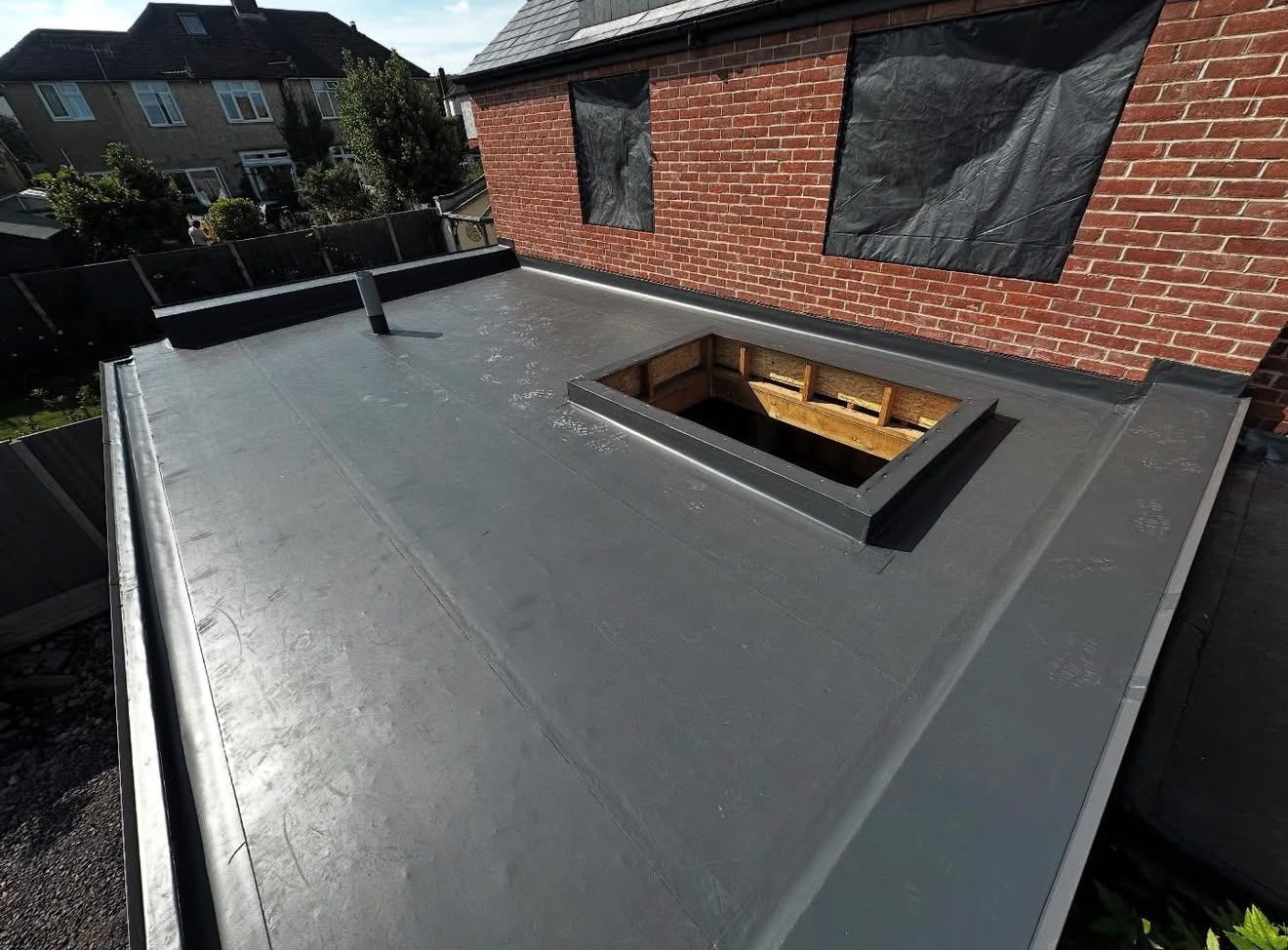 Refurbished flat roof with new membrane on a domestic extension